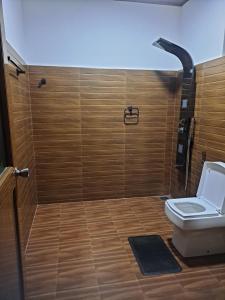 a bathroom with a toilet and a shower at Nine Arch Gap in Ella