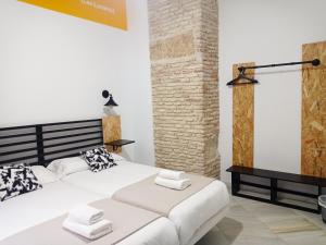 Posteľ alebo postele v izbe v ubytovaní Planeta Cadiz Hostel