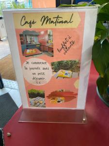 a sign on a table with a picture of a house at Class'Eco Albi in Albi