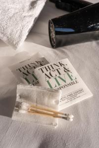 a couple of tickets and a pen on a table at B&B HOTEL Bordeaux Bassins à flot in Bordeaux