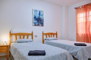 A bed or beds in a room at Apartamento en el centro de Portosin