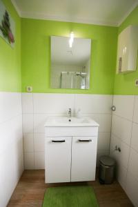 a bathroom with a sink and a mirror at Marin in Barth