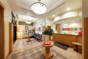 a lobby of a hospital with a waiting room at Blossom Hotel Hirosaki in Hirosaki