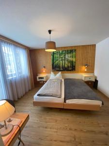Postel nebo postele na pokoji v ubytování Hotel Garni Jägerhof
