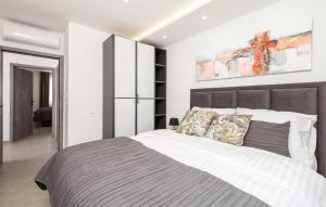 a bedroom with a large bed in a room at Villa Milla in Opatija +23 photos