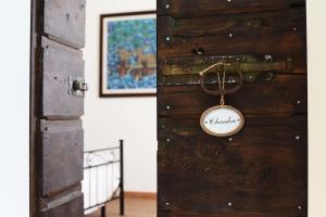 a wooden door with a tag on it at F&F vista Lago in Cernobbio