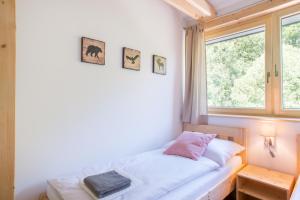 Postel nebo postele na pokoji v ubytování Apartmány Pstruží AP19