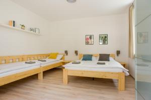 Postel nebo postele na pokoji v ubytování Apartmány Pstruží AP19