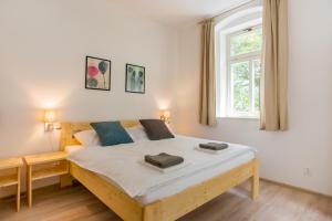 Postel nebo postele na pokoji v ubytování Apartmány Pstruží AP19