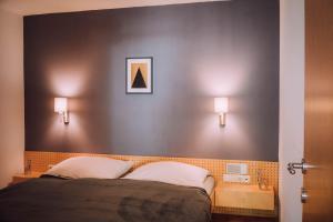 A bed or beds in a room at Apartment Auenfeld Widderstein