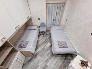Postel nebo postele na pokoji v ubytování Appartamento in Piazza Vittorio Veneto con parcheggio, Torino