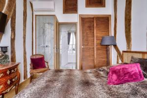 Posteľ alebo postele v izbe v ubytovaní Grandiose appartement au cœur de Paris