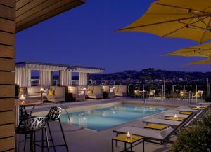 a swimming pool on the roof of a hotel at Kimpton Hotel Wilshire, an IHG Hotel in Los Angeles