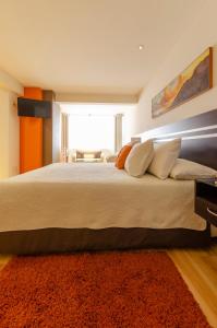 Säng eller sängar i ett rum på Hotel NC La Paz