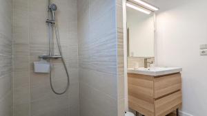 a bathroom with a shower and a sink at L'Orée du bois in Selongey +17 photos