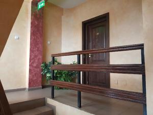 an empty building with a staircase and a door at Vila Predeal Holidays in Predeal