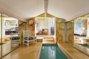 a house with a swimming pool in the middle of a room at Chalet Galadhrim Chamonix Mont Blanc Valley in Les Houches