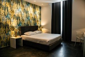 Postel nebo postele na pokoji v ubytování Hotel Up Wellness & Spa
