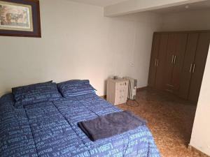 En eller flere senge i et værelse på Amplio Departamento Residencial en La Molina