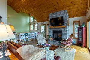 a living room with a couch and a fireplace at 1 Amazing View in Blowing Rock
