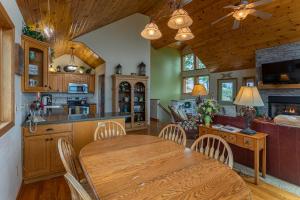 a kitchen and dining room with a wooden table and chairs at 1 Amazing View in Blowing Rock