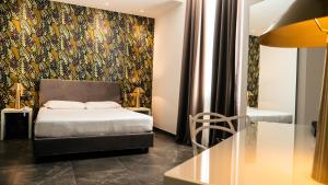 Postel nebo postele na pokoji v ubytování Hotel Up Wellness & Spa