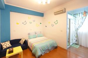 Postel nebo postele na pokoji v ubytování Hualien Lidu House