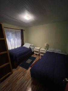 Кровать или кровати в номере Casa amoblada en Coronel