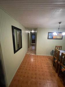 an empty hallway of a house with a wooden floor at Casa amoblada en Coronel in Concepción