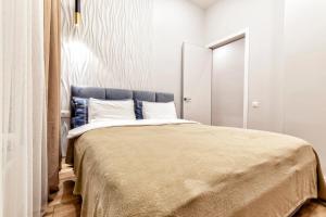 Aura Business class apartment tesisinde bir odada yatak veya yataklar
