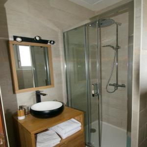 a bathroom with a sink and a shower at Chalet Ouréa in Campan