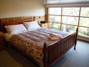 A bed or beds in a room at 81 on Freycinet