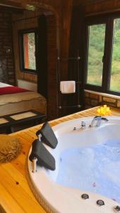 a bathroom with a bath tub in a room at Zilkale Butik Otel in Çamlıhemşin
