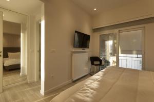 Łóżko lub łóżka w pokoju w obiekcie Über Lux 2 BR New Penthouse with Acropolis View
