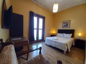 a hotel room with a bed and a window at Casablanca Hostal in Arequipa