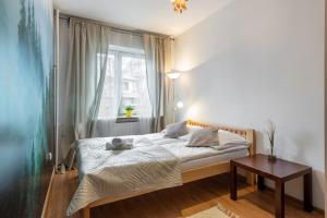 Posteľ alebo postele v izbe v ubytovaní Apartament Rema w centrum APARTZAKOP