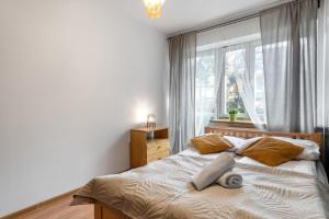 Posteľ alebo postele v izbe v ubytovaní Apartament Rema w centrum APARTZAKOP