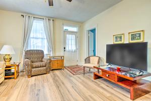 a living room with a large flat screen tv at Peaceful Indianapolis Retreat 20 Min to Dtwn in Indianapolis