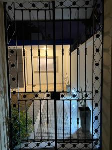 a view from a gate of a balcony with a plant at Aromas de Azahar in Bella Vista