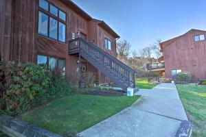 a house with a staircase on the side of it at Vernon Township Condo with Mountain Views! in Vernon Township