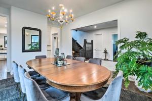 a dining room with a wooden table and chairs at Grand Long Branch Home 1 Block to Beach! in Long Branch