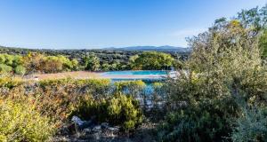 an aerial view of a swimming pool with trees at Hotel Las Errizas by Vivere Stays in Alcalá del Valle