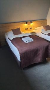 Ένα ή περισσότερα κρεβάτια σε δωμάτιο στο Villa Jaśmin