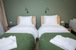 Voodi või voodid majutusasutuse Hotel 1700 toas