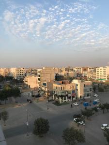 a view of a city with buildings and a parking lot at Mukhtar Homes Bahria Town Lahore in Lahore