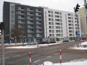 an empty city street with a large building at 4You Apartament in Białystok