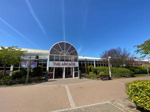 a building with a sign that reads the arcade at Parkside 41 - Located on Butlins Skegness Caravan Village, WiFi - Meadow Lakes Caravan & Lodge Hire in Lincolnshire