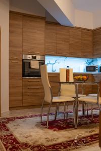 a kitchen with a table and chairs in a room at Guest House Siatista in Siatista