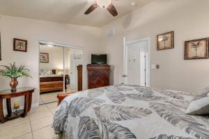 a bedroom with a bed and a ceiling fan at Walk to the Beach and Restaurants! - Coconut Villa's Suite 2 in St Pete Beach