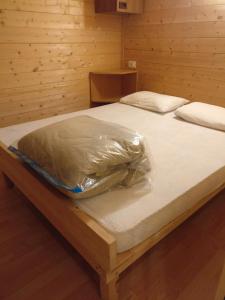 a bed in a room with a plastic bag on it at Le sorgenti - Chalet 42 in Palazzuolo sul Senio